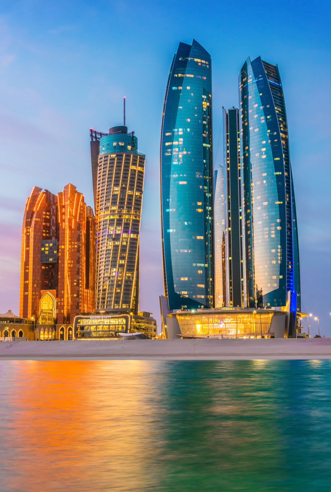 Etihad Towers on the Abu Dhabi waterfront at dusk